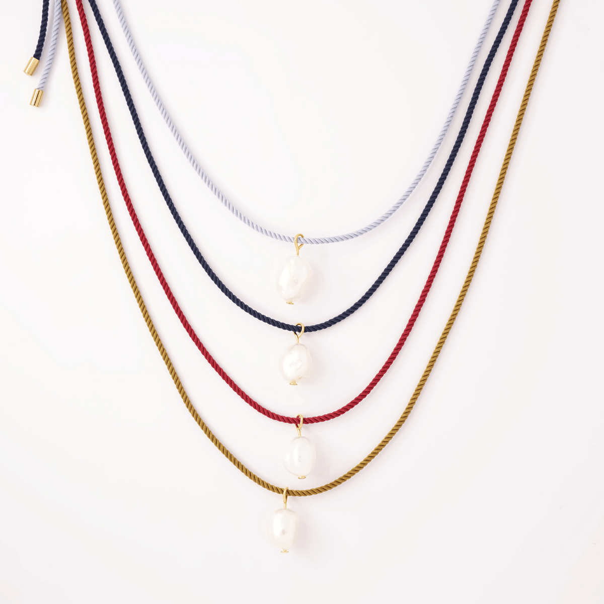 Pearl + red cord necklace