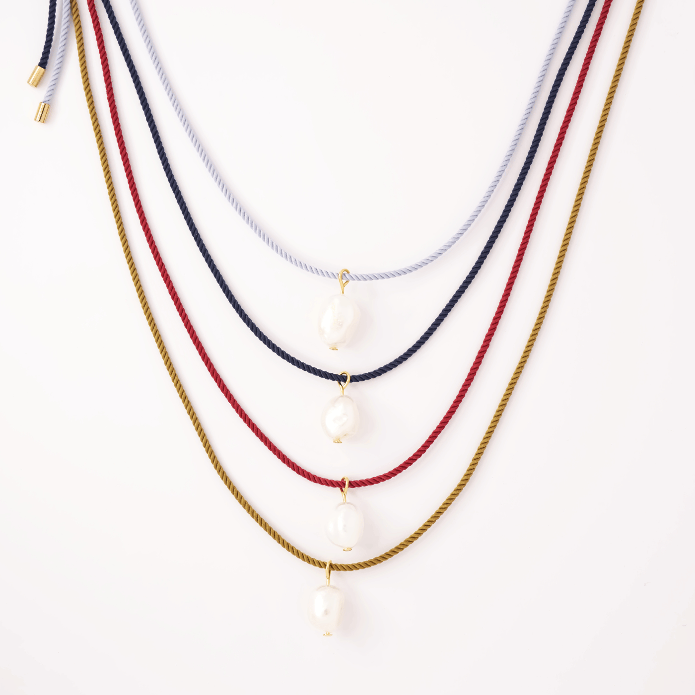 Pearl + red cord necklace