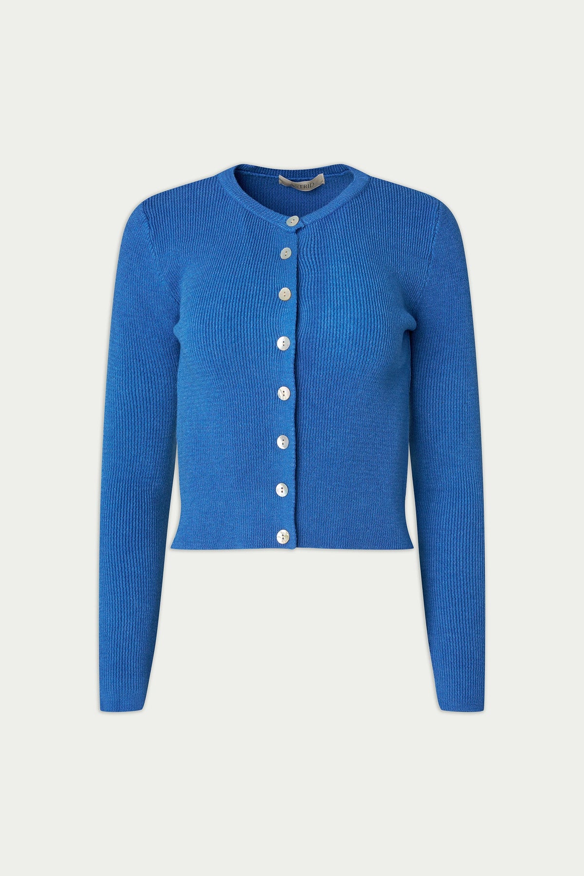 Blue cardigan with white buttons on a light gray background