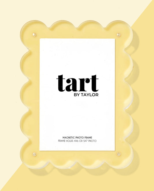 Yellow magnetic photo frame with 'tart by Taylor' branding on a yellow background