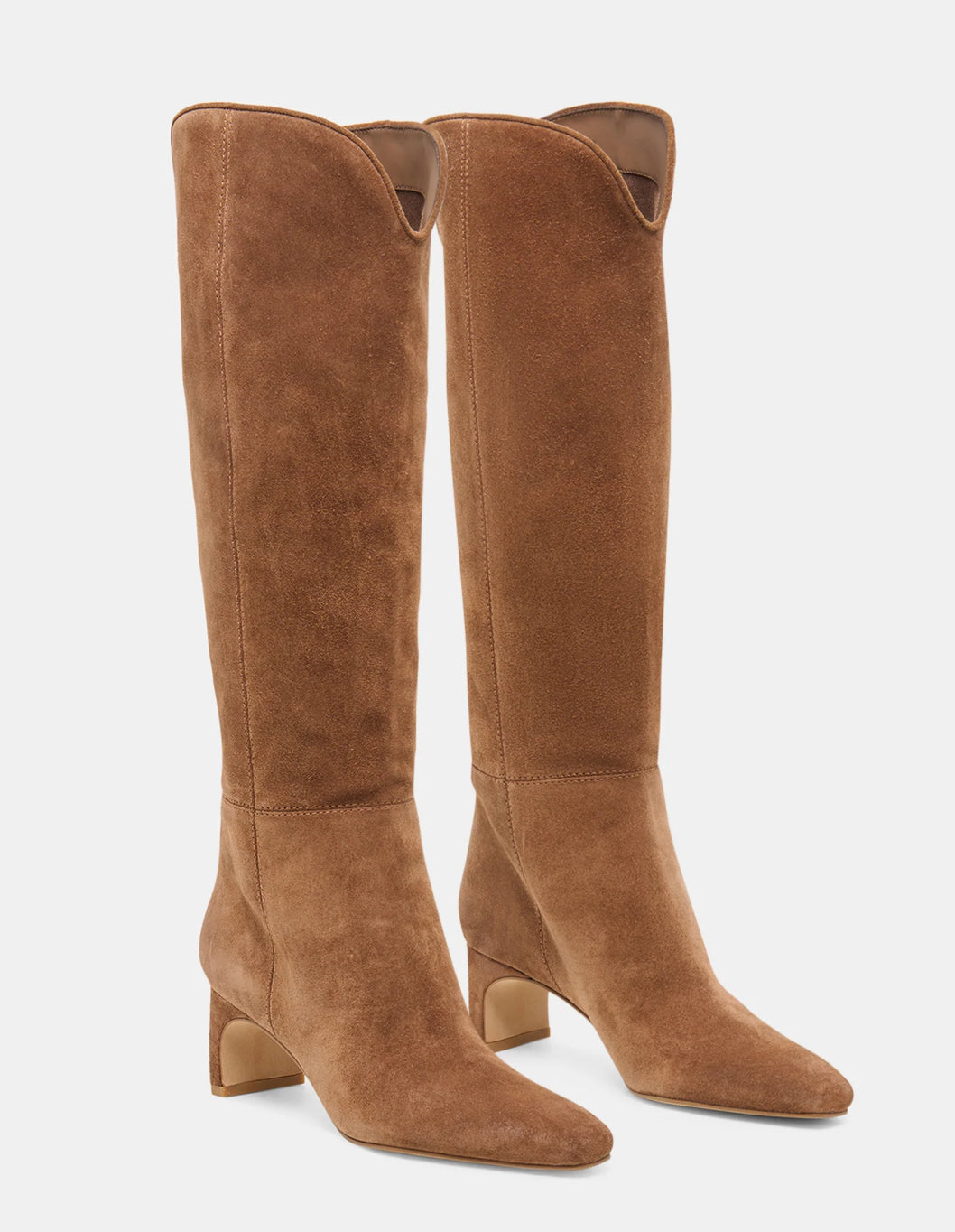 A pair of tall brown suede knee-high boots with low block heels and pointed toes, shown against a plain light gray background.