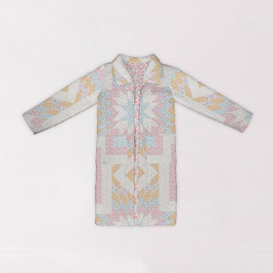 Patterned quilted barn coat on a white background