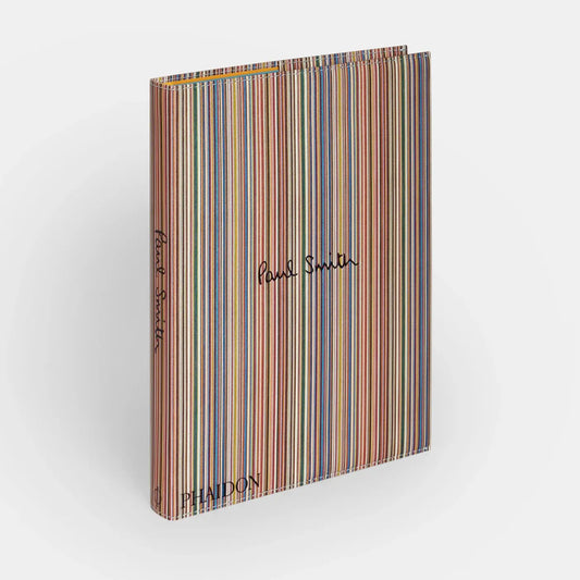 Multicolored striped book with 'Paul Smith' and 'Phaidon' branding on a white background